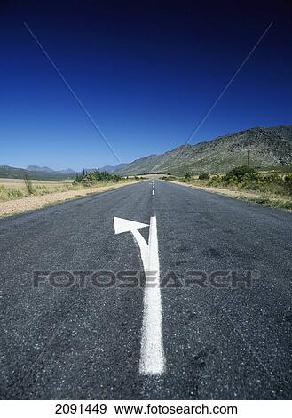 Arrow Road Marking In The Little Karoo Near Garcia, Western Cape, South Africa. View Large Photo Image Stock Photo - Arrow Road Marking In The Little Karoo Near Garcia, Western Cape, South Africa.. Fotosearch