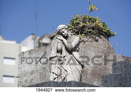 Stock Photo - Art Nouveau sculpture atop a mausoleum at the Cementerio de la Recoleta, Buenos Aires, Capital Federal, Argentina. Fotosearch