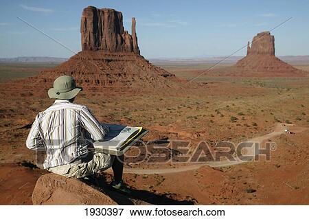 Artist sketching the East and West Mitten Buttes of Monument Valley; Arizona, United States of America View Large Photo Image Stock Photo - Artist sketching the East and West Mitten Buttes of Monument Valley; Arizona, United States of America. Fotosearch