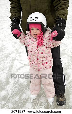 Artist's Choice: Dad Teaching Daughter To Skate, Ontario View Large Photo Image Stock Photo - Artist's Choice: Dad Teaching Daughter To Skate, Ontario. Fotosearch