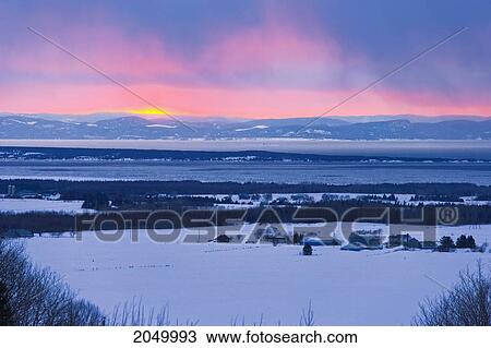 Stock Image - Artist's Choice: Farmland, St. Lawrence River And Mountains Of Charlevoix Region, Bas-Saint-Laurent Region, Saint-Eloi, Quebec. Fotosearch