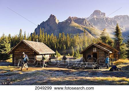 Stock Photo - Artist's Choice: Hikers, Elizabeth Parker Hut And Mountains, Yoho National Park, British Columbia. Fotosearch