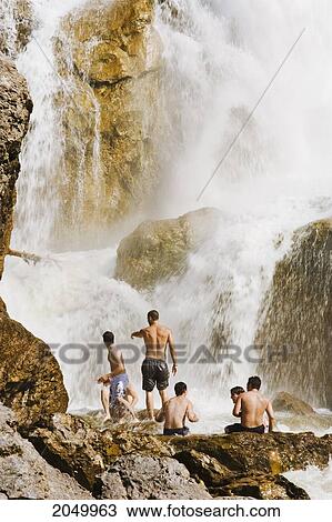 Stock Image - Artist's Choice: Swimmers At Neigette Falls, Bas-Saint-Laurent Region, Saint-Anaclet, Quebec. Fotosearch