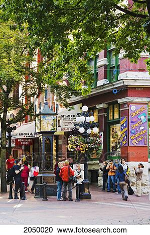 Stock Image - Artist's Choice: Tourist And Gastown Steam Clock, Vancouver, British Columbia. Fotosearch
