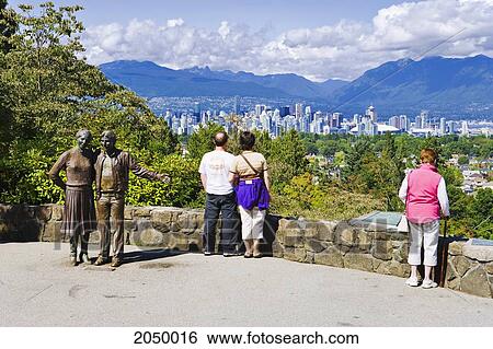 Stock Photograph - Artist's Choice: Tourist Overlooking Queen Elizabeth Park And Downtown, Vancouver, British Columbia. Fotosearch