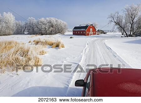 Stock Image - Artist's Choice: Truck Along Country Lane With Red Barn In Background, Winter, Near Oakbank, Manitoba. Fotosearch