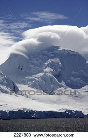 As Seen From A Cruise Ship Sailing; Antarctica, Cloud Formation Rests Upon A Mountain In Antarctica View Large Photo Image Stock Image - As Seen From A Cruise Ship Sailing; Antarctica, Cloud Formation Rests Upon A Mountain In Antarctica. Fotosearch