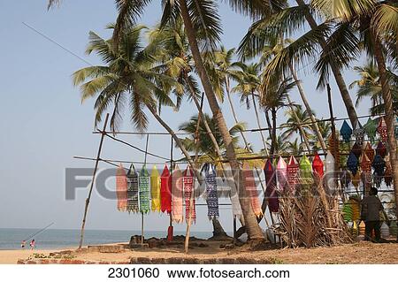 Stock Image - At world famous Anjuna Flea Market, held on Wednesdays on Anjuna Beach, Goa State, India, Asia.. Fotosearch