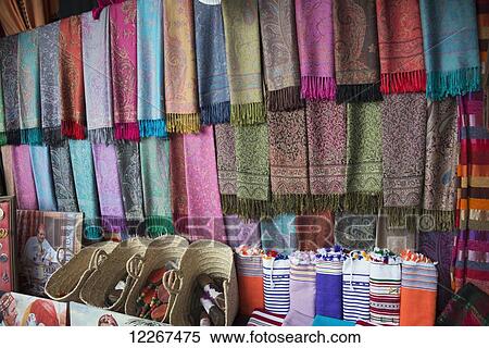 Stock Photography - Attractive array of pashmina scarves outside village shop; Chefchaouen, Morocco. Fotosearch