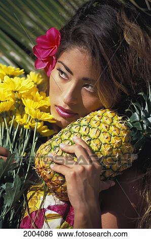 Attractive Local Woman Holds Pineapple, Bouquet Of Flowers Pink Plumeria In Ear, Sultry View Large Photo Image Stock Photograph - Attractive Local Woman Holds Pineapple, Bouquet Of Flowers Pink Plumeria In Ear, Sultry. Fotosearch