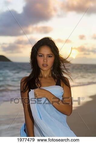 Attractive Woman Playful On The Beach In The Beautiful Sunset Light. View Large Photo Image Stock Photo - Attractive Woman Playful On The Beach In The Beautiful Sunset Light.. Fotosearch