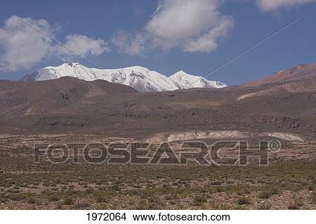Aucanquilcha Volcano, As Seen From Puquios, Antofagasta Region, Chile View Large Photo Image Picture - Aucanquilcha Volcano, As Seen From Puquios, Antofagasta Region, Chile. Fotosearch