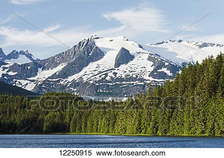 Stock Photography - Auke Lake, Mendenhall Glacier and Mount Mather; Alaska, United States of America. Fotosearch