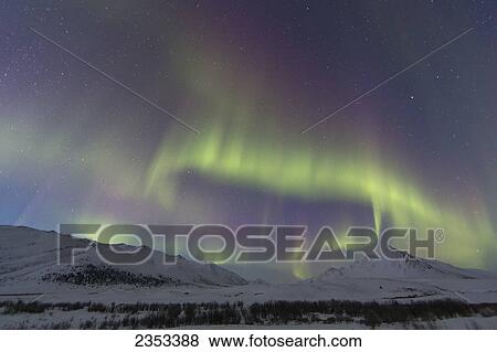 Stock Photo - Aurora Borealis At Twilight Above Angelcomb Mountain Along The Dempster Highway; Yukon, Canada. Fotosearch