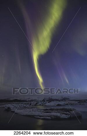 Picture - Aurora borealis dances over the glacial lagoon jokulsarlon; iceland. Fotosearch