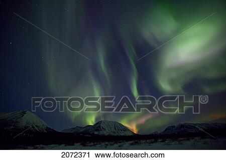 Stock Image - Aurora Borealis (Northern Lights) In The Yukon, Canada. Fotosearch