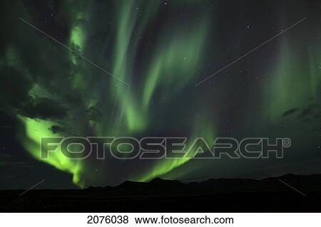 Stock Photo - Aurora Borealis Over Mountains Along The Dempster Highway; Yukon Canada. Fotosearch
