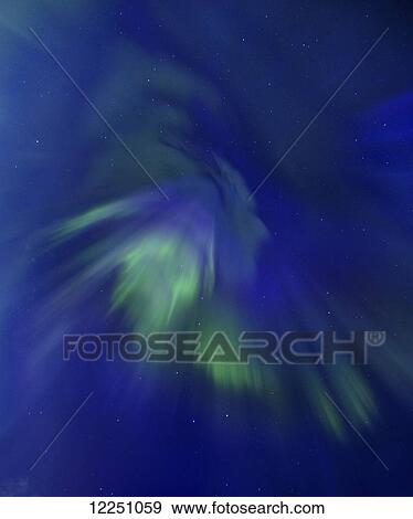 Stock Photo - Aurora forms the profile of the Great Bear Chief in the Ursa Major (Great Bear) constellation; Alaska, United States of America. Fotosearch