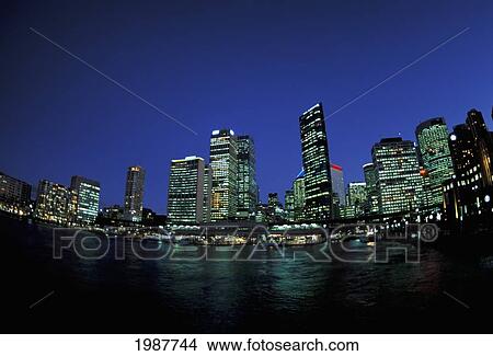 Picture - Australia, New South Wales, Circular Quay Cove and city buildings at night; Sydney. Fotosearch
