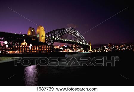 Australia, New South Wales, Harbor Bridge at night with city lights in distance; Sydney View Large Photo Image Stock Photo - Australia, New South Wales, Harbor Bridge at night with city lights in distance; Sydney. Fotosearch
