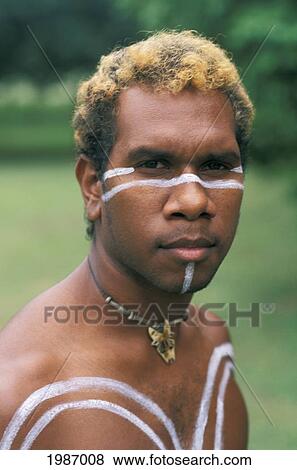 Stock Photo - Australia, Queensland, Cairns, Tjapukai, Portrait Of Aboriginal Native Man With Paint On Body.. Fotosearch