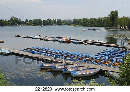 Austria, Boats for hire moored on pier at Alte Donau with view of river; Vienna View Large Photo Image Stock Photo - Austria, Boats for hire moored on pier at Alte Donau with view of river; Vienna. Fotosearch