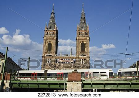 Austria, Church near Thaliastrasse ungerground station with tram in foreground; Vienna View Large Photo Image Stock Image - Austria, Church near Thaliastrasse ungerground station with tram in foreground; Vienna. Fotosearch