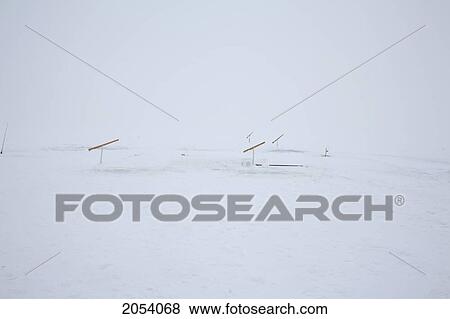 Automatic Fishing Poles Set Up For Ice Fishing, Ile De Perrot, Quebec. View Large Photo Image Stock Photo - Automatic Fishing Poles Set Up For Ice Fishing, Ile De Perrot, Quebec.. Fotosearch