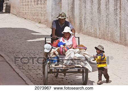 Stock Photo - Aymara Family On A Tricycle, Copacabana, La Paz Department, Bolivia. Fotosearch