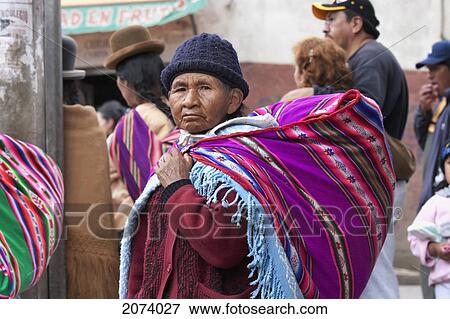 Aymara Woman Carrying A Baby On Her Back, La Paz, Bolivia View Large Photo Image Stock Photo - Aymara Woman Carrying A Baby On Her Back, La Paz, Bolivia. Fotosearch