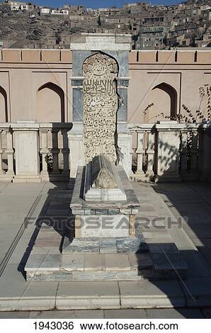 Stock Photograph - Babur's Tomb With The Original Headstone And A New Marble Fence After The Restoration Of Bagh-I-Babur Shah (Babur's Garden) - Kabul,, Afghanistan. Fotosearch