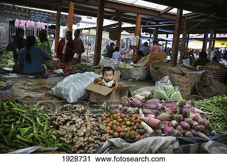 Stock Image - Baby In A Box In Thimpu Market. Fotosearch