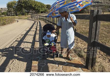 Baby In A Stroller Near Ranohira, Fianarantsoa Province, Madagascar View Large Photo Image Stock Photograph - Baby In A Stroller Near Ranohira, Fianarantsoa Province, Madagascar. Fotosearch