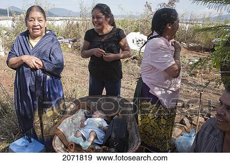 Stock Photo - Baby Resting In A Wheelbarrow During The Celebration Of D. Fotosearch