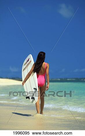 Back View Of Sexy Woman In Pink Bathing Suit, Holds White Surfboard In Water View Large Photo Image Stock Photography - Back View Of Sexy Woman In Pink Bathing Suit, Holds White Surfboard In Water. Fotosearch