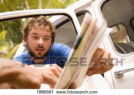 Stock Image - Backpacker Asking Local For Directions, Close Up. Fotosearch