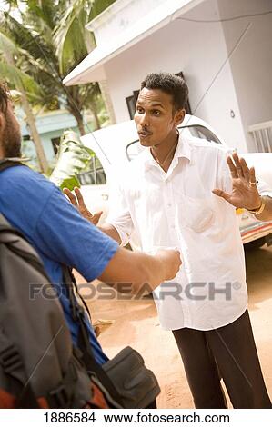 Backpacker Negotiating With Taxi Driver View Large Photo Image Picture - Backpacker Negotiating With Taxi Driver. Fotosearch