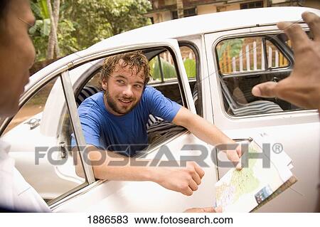 Backpacker Negotiating With Taxi Driver View Large Photo Image Stock Image - Backpacker Negotiating With Taxi Driver. Fotosearch