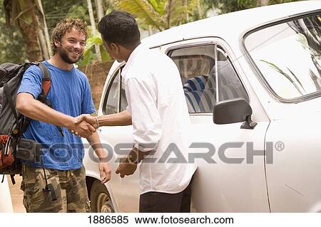 Backpacker Shaking Taxi Drivers Hands View Large Photo Image Stock Photography - Backpacker Shaking Taxi Drivers Hands. Fotosearch