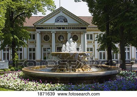 Stock Photo - Bad Neuenahr-Ahrweiler, Nordrhein-Westfalen, Germany; A Fountain At The Front Of A Spa. Fotosearch