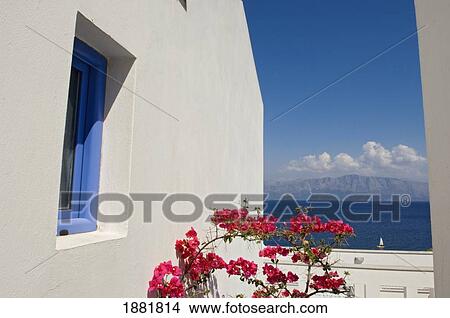 Picture - Balcony With Pink Blossomed Flowers In Resort Overlooking Some Of The Ionian Islands.. Fotosearch