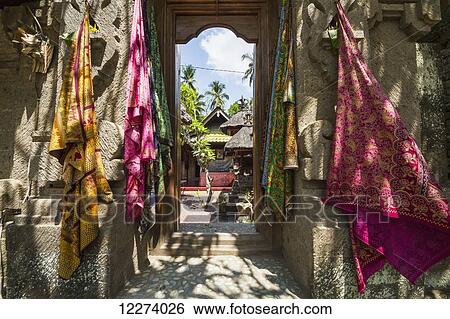 Stock Photograph - Balinese fabrics for sale in a store, Tenganan Pegringsingan, Bali, Indonesia. Fotosearch