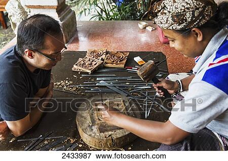 Stock Photo - Balinese wood carver at the Museum Puri Lukisan, Ubud, Bali, Indonesia. Fotosearch