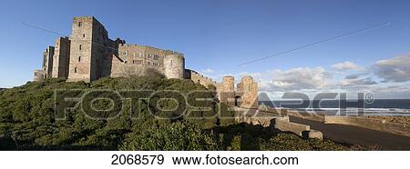 Bamburgh Castle Ruins Against A Blue Sky; Bamburgh Northumberland England View Large Photo Image Stock Photo - Bamburgh Castle Ruins Against A Blue Sky; Bamburgh Northumberland England. Fotosearch