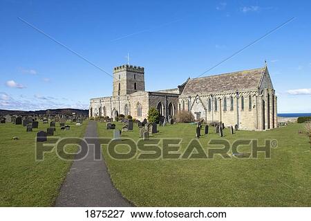 Stock Photo - Bamburgh, Northumberland, England; A Church Cemetery. Fotosearch