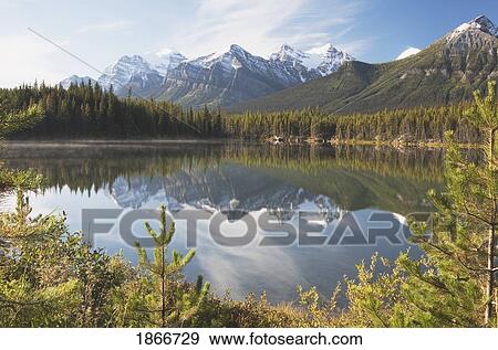 Stock Photo - Banff National Park, Alberta, Canada; Mountains Reflected In A Lake In Late Summer. Fotosearch