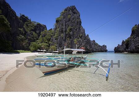 Stock Photo - Bangka Boats In The Small Lagoon On Miniloc Island; El Nido, Bacuit Archipelago, Palawan, Philippines. Fotosearch