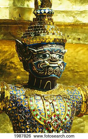 Stock Photograph - Bangkok, statue of mythological demon; Grand Palace, Wat Phra Pho. Fotosearch