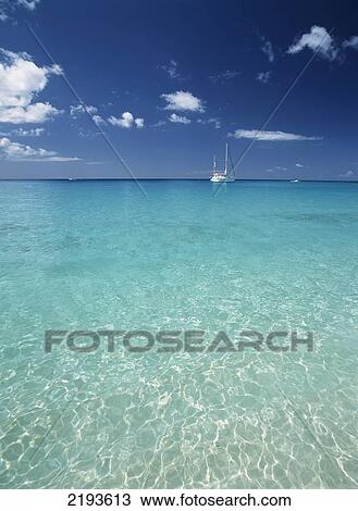 Barbados, Sailing boat moored in shallow waters; Sandy Lane beach View Large Photo Image Stock Image - Barbados, Sailing boat moored in shallow waters; Sandy Lane beach. Fotosearch