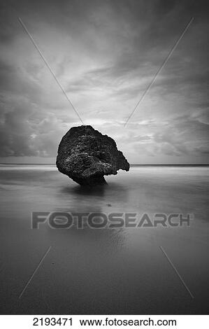 Stock Image - Barbados, Strange shaped rock in shallow waters; Bathsheba. Fotosearch